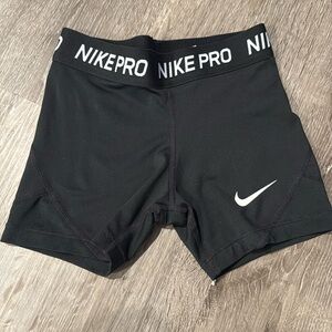 Nike Girls tight shorts. 
stretchy waistband 
comfortable fit